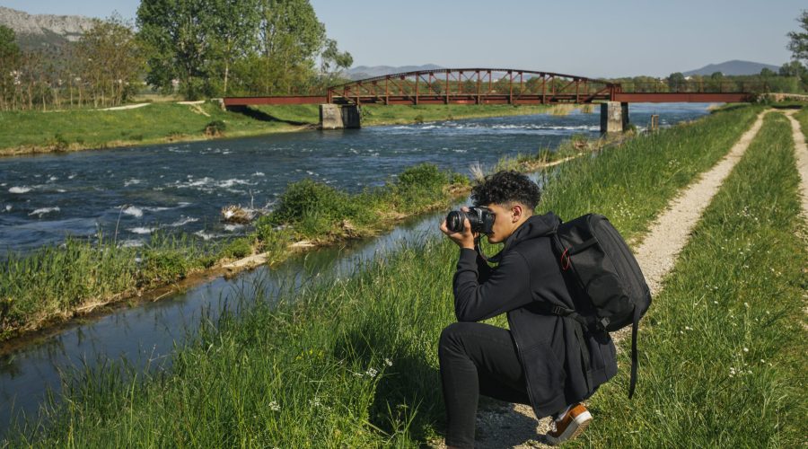 young-hiker-taking-photo-idyllic-river